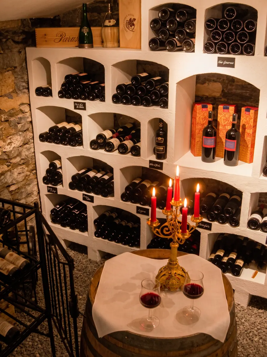 Wine cellar with a candle on a barrel
