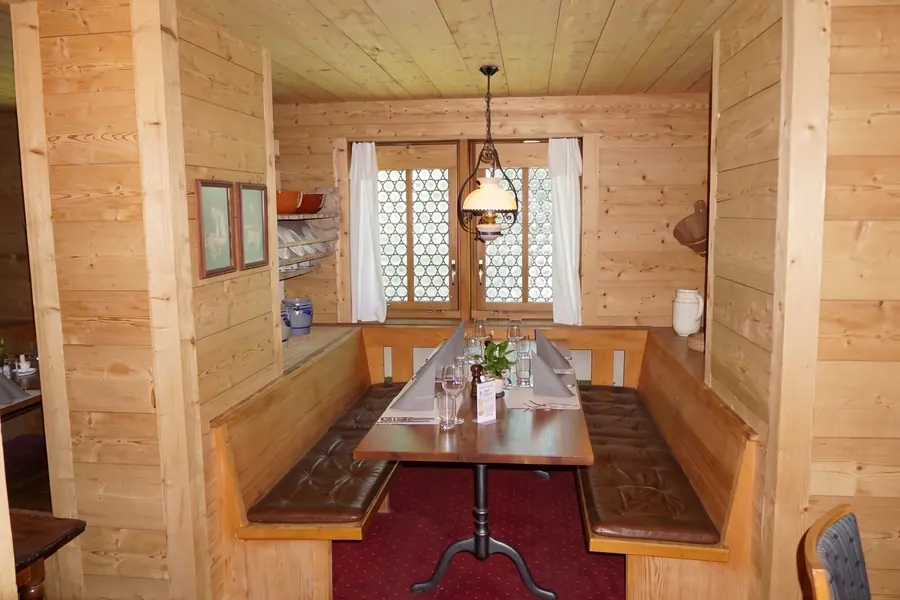 Parlour with corner bench and wooden ceiling