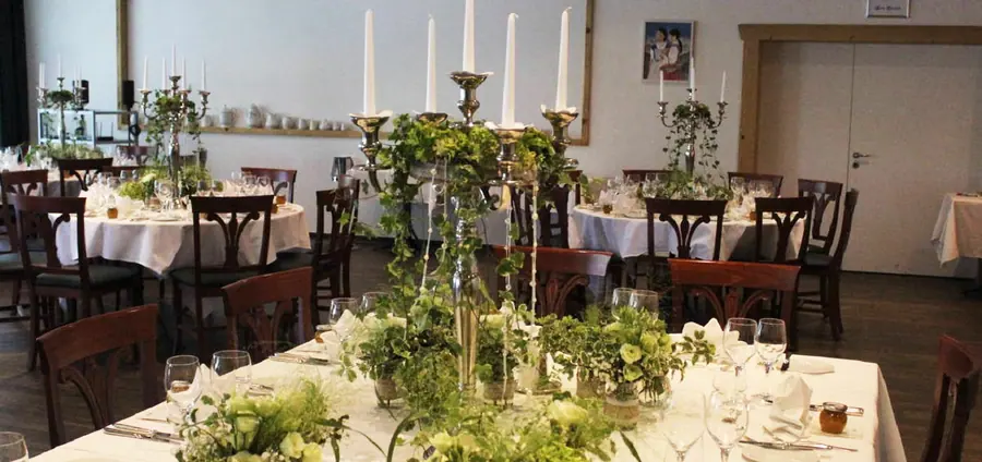 Long table with candelabra and greenery